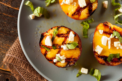 Grilled Peaches with Goat Cheese, Hot Honey, and Mint