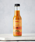 AR's Peach Hot Sauce on Table