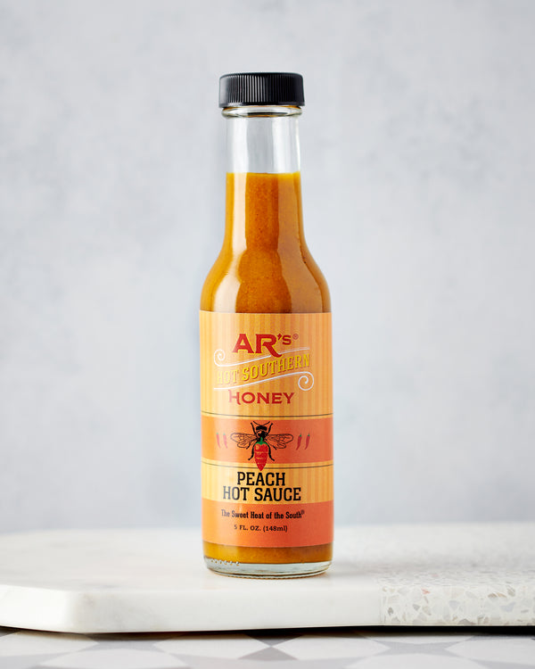 AR's Peach Hot Sauce on Table